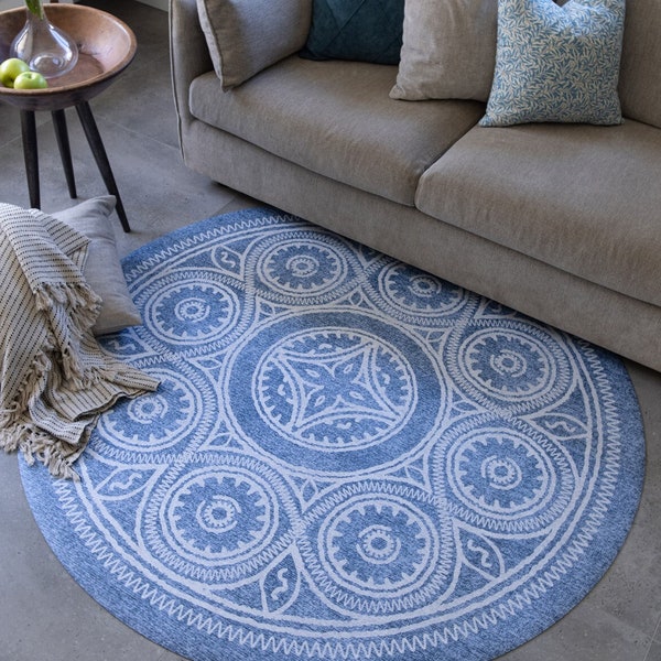 Round vinyl floor mat with blue ethnic geometric design. Printed to order and cut by hand. Home design, area rug.