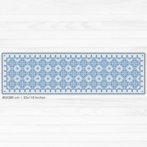 May include: A blue and white patterned runner rug with a geometric design. The rug is 32 inches by 110 inches.