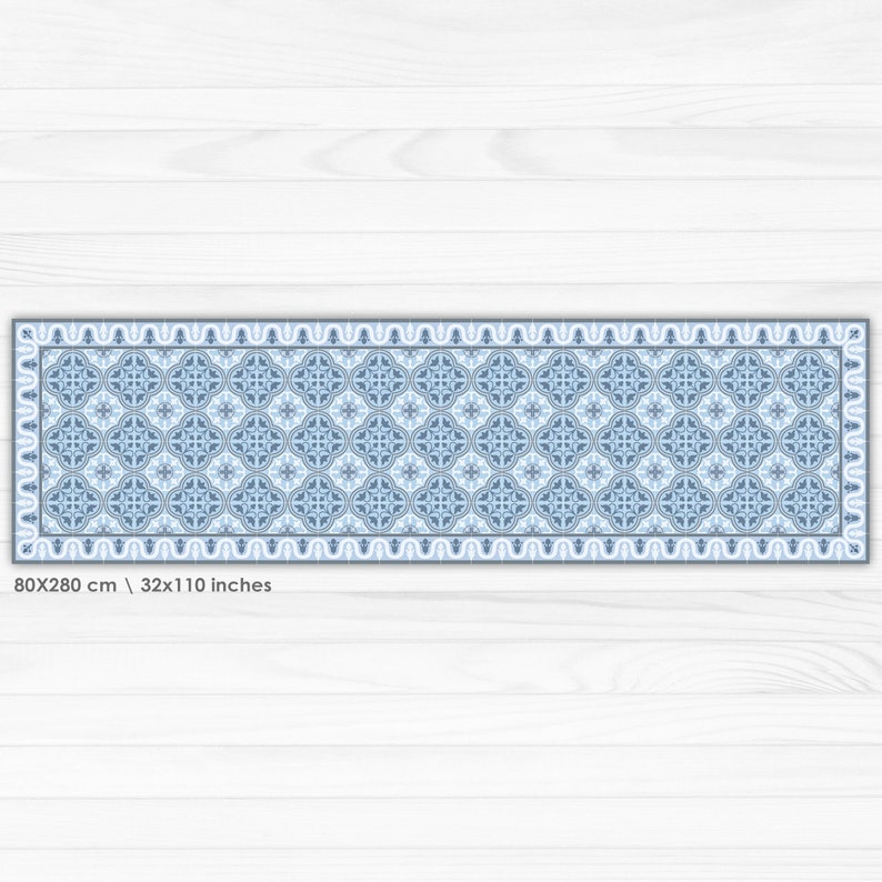 May include: A blue and white patterned runner rug with a geometric design. The rug is 32 inches by 110 inches.