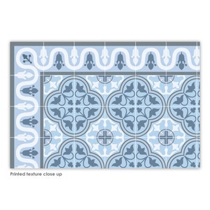 May include: A blue and white patterned floor tile with a repeating design of stylized leaves and flowers. The tile has a border with a wavy design.