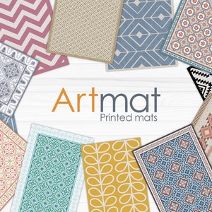 May include: Assortment of colorful printed floor mats with geometric and floral patterns. The mats are arranged in a circle around the text "Artmat Printed mats".