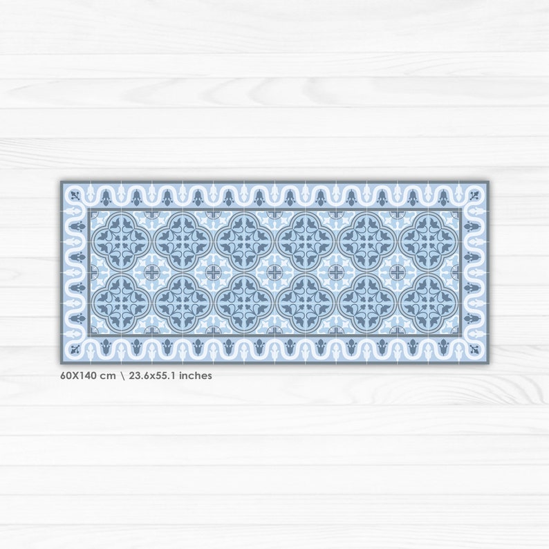 May include: A blue and white patterned rug with a geometric design. The rug is 60x140 cm or 23.6x55.1 inches.