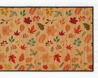 Bamboo carpet with printed autumn leaves. Turquoise, red, yellow, orange and brown leaves. Natural bamboo mat.