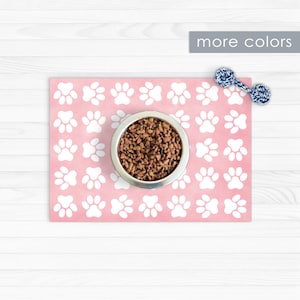 Pet placemat. Paw print design in pink printed on vinyl floor mat / dog placemat / cat mat / cat placemat / pet feeding mat.