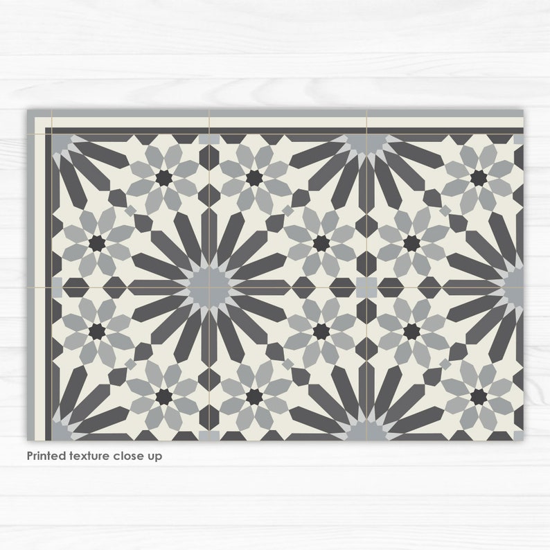 May include: A black and white geometric tile pattern with a repeating starburst design. The tile is made of ceramic and has a glossy finish.