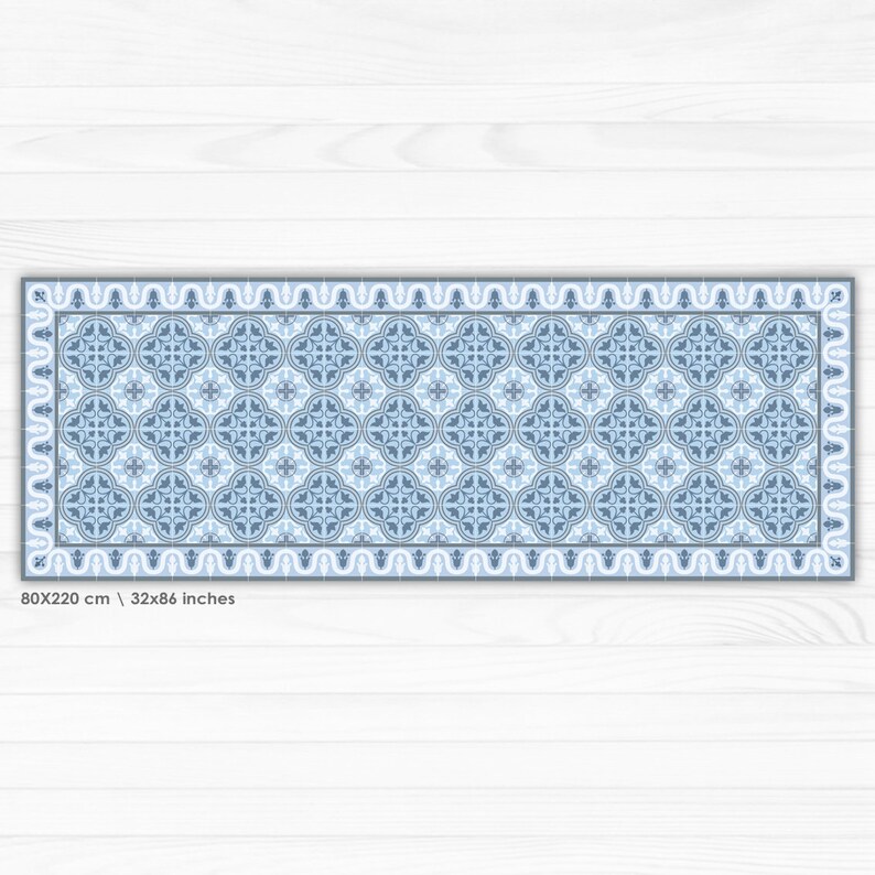 May include: A blue and white patterned rug with a geometric design. The rug is 32 inches by 86 inches and is made of a durable material.