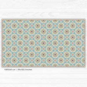 May include: A beige rug with a repeating pattern of brown, blue, and pink stylized flowers. The rug measures 59x102.3 inches.
