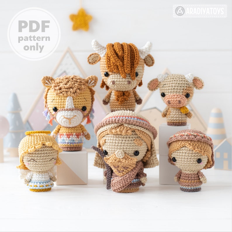 May include: A set of seven crocheted amigurumi figures, including a cow, a camel, a shepherd, a baby angel, and three other figures. The figures are all in a neutral colour palette of brown, beige, and white.