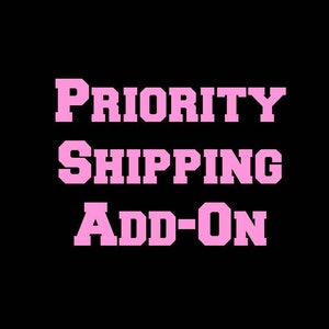 May include: Pink text on a black background reads "PRIORITY SHIPPING ADD-ON".