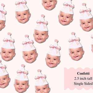 May include: Confetti featuring baby faces wearing party hats with pink bows. The hats are white with a pink bow and a pink pom-pom on top. The confetti is 2.5 inches tall and single-sided.