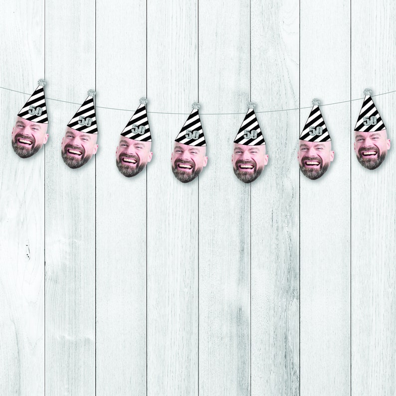 cute 50th birthday face banner with a black and white party hat on top