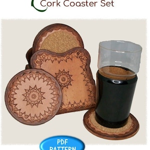 May include: A set of cork coasters with a leather pattern design. The set includes round and square coasters, along with a holder. The coasters have a brown and tan color scheme, with intricate embossed patterns. The image also includes a glass with a dark liquid.