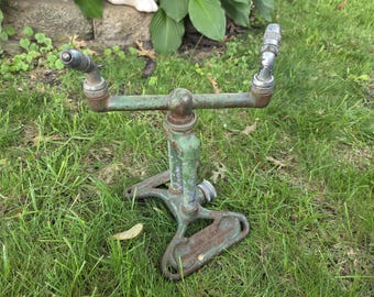 Rain King Model H-1 Rotating Lawn Water Sprinkler, manufactured by the Chicago Flexible Shaft Company