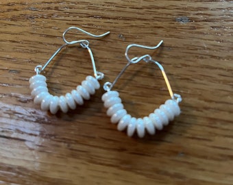 White dangle earrings