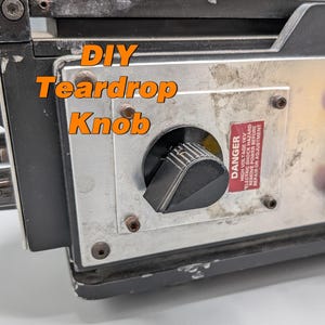May include: A black and silver electronic device featuring a black teardrop-shaped control knob on a metal faceplate. The text DIY Teardrop Knob is overlaid in orange. A red warning label reads DANGER HIGH VOLTAGE. Two red cylindrical bars are visible.