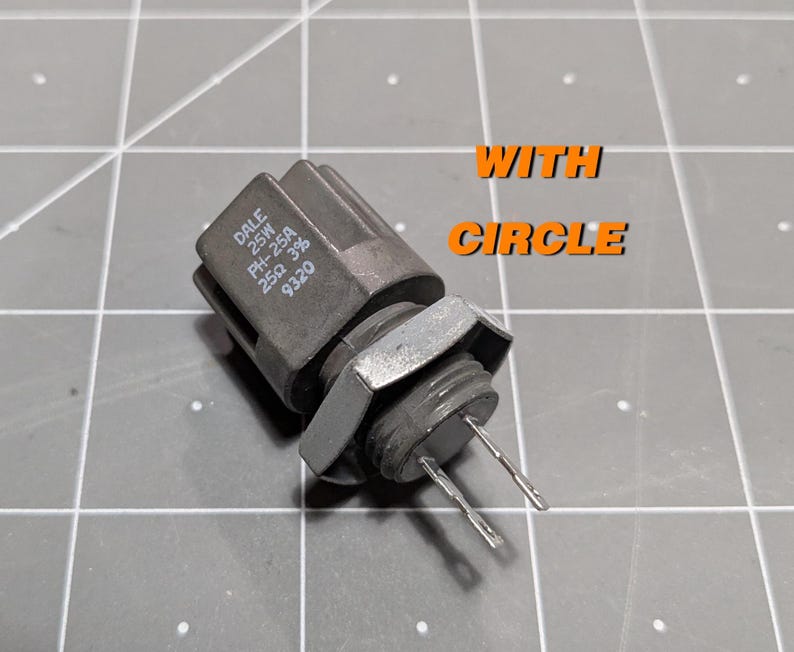 May include: A gray Dale 25W PH-25A 25&Omega; 3/8 9320 resistor with two silver-colored leads.