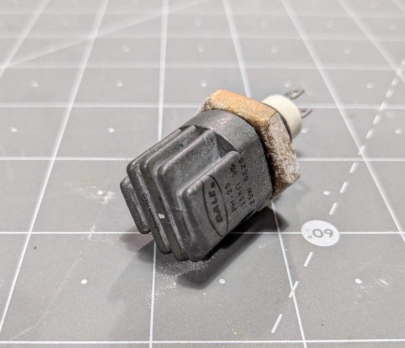 May include: A black and gray automotive sensor with the text "VALEO", "HM-11", "22.5", "MADE", "G7.89", and "M5" printed on the side.