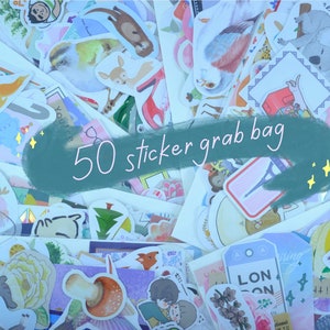 May include: A collection of 50 assorted stickers featuring various designs, including animals, plants, and travel-themed illustrations. The stickers are in a grab bag, with a teal banner that reads "50 sticker grab bag".