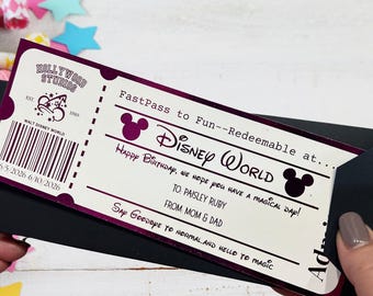 May include: A rectangular paper ticket with a cream background and dark purple accents. It features the text FastPass to Fun, Disney World, and Happy Birthday, we hope you have a magical day! To: Paisley Ruby, From: Mom & Dad. It includes a barcode and dates.