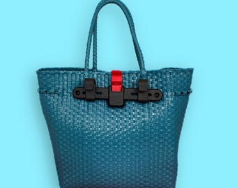 Alforja para bicicleta, bolsa de mano tejida de plástico reciclado en color verde azulado