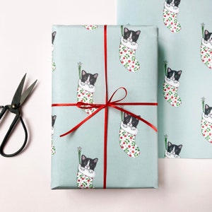 Carta da regalo natalizia con gatti in bianco e nero