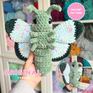 May include: A plush crochet butterfly toy made of sage green yarn with large black eyes and pink cheeks. The wings feature a variegated pastel blue, pink, and yellow yarn with dark green edges. Text on the image reads CROCHET PATTERN and ORIGINAL VERSION.
