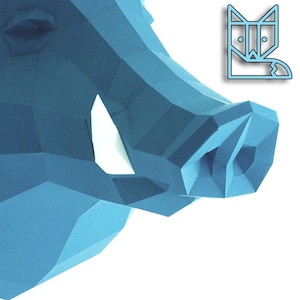May include: A blue papercraft model of a wild boar's head. The model is made of folded paper and has a realistic appearance.