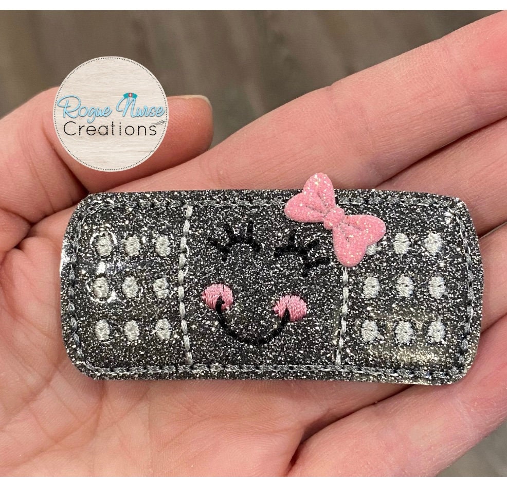 Gun Metal Gray, Glitter Shiny Bandaid With Your Choice of Bow Color,  attached to a retractable badge reel. Nurse Name Badge