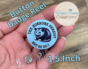 The Horrors Persist But So Do I, Opossum Button Style Retractable Badge Reel, Light Blue Background, Opossum Button Badge Holder