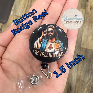 May include: A black button badge reel with a 1.5 inch diameter button featuring a cartoon image of Jesus wearing sunglasses and holding a cup of iced coffee. The button has the text "I'm Telling Dad" printed on it. The badge reel is made of clear plastic and has a silver metal clip.