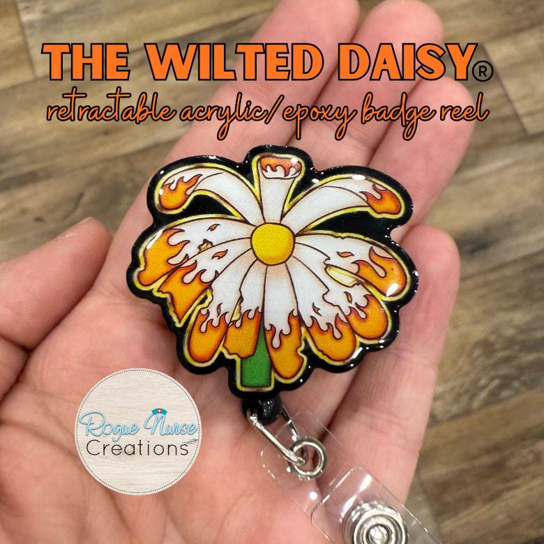 The WILTED Daisy™ Phoenix Edition Acrylic Badge Reel. Original