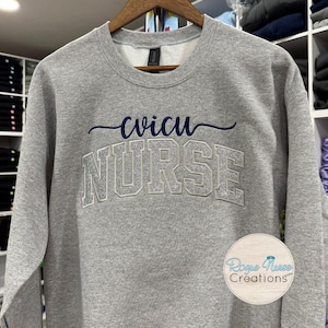 Silver Glitter Appliqué CVICU Nurse Embroidered Sweatshirt, Sport Gray Pullover Sweater with Custom Color Embroidered CVICU Specialty.
