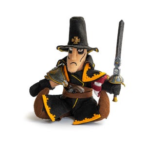 May include: A handmade plush doll of a seated figure in a black hat and coat with yellow trim. The doll holds a sword and has a pistol at its waist. The figure has a stern expression and is set against a white background.