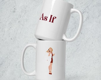 Può includere: Due tazze in ceramica bianca impilate l'una sull'altra. La tazza superiore ha il testo "As If" in lettere rosse. La tazza inferiore presenta un'illustrazione di cartone animato di una donna con un vestito rosso e un cappotto di pelliccia bianco che tiene un bicchiere di champagne.