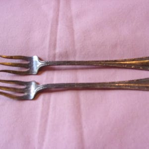 Par de tenedores de cóctel Gorham, circa 1906.