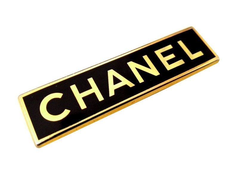 Chanel gold and black colour enamel and metal vintage Employee brooch pin  badge