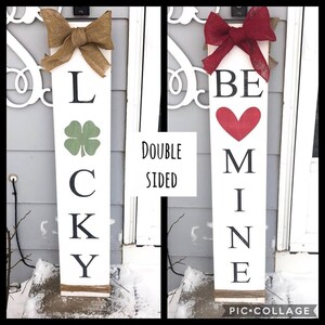 May include: Double-sided wooden sign with two designs. One side says "LUCKY" with a green four-leaf clover. The other side says "BE MINE" with a red heart.