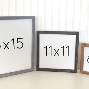 May include: Three wooden picture frames with white backgrounds and black text. The frames are different sizes: 15x15 inches, 11x11 inches, and 8x8 inches. The frames are all different colors: gray, black, and brown.