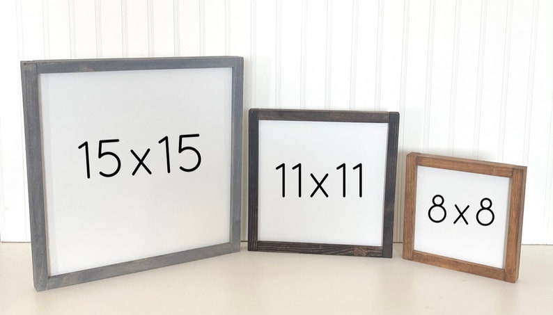 May include: Three wooden picture frames with white backgrounds and black text. The frames are different sizes: 15x15 inches, 11x11 inches, and 8x8 inches. The frames are all different colors: gray, black, and brown.