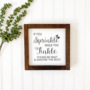 If you sprinkle when you tinkle please be neat and sanitize the seat framed wooden bathroom farmhouse sign. Cute framed bathroom sign decor