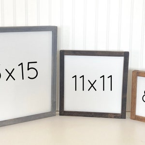 May include: Three wooden picture frames with white backgrounds and black text. The frames are different sizes: 15x15 inches, 11x11 inches, and 8x8 inches. The frames are all different colors: gray, black, and brown.