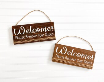 Welcome please remove your shoes wooden front door sign hung with twine. Hanging Welcome front door sign. Remove your shoes front porch sign