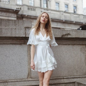 white short flowy dress Ruffle Mini - Solid V-Neck A-Line Dress for Women | XX-Large From Yes to I do this flattering little white dress is what to wear to a stylish rehearsal dinner and wedding reception first dance Sun's Out Mini Dress White