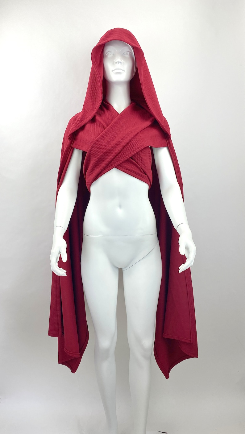style 1: scarf piece crossed across the chest and tied in the back with hood up
