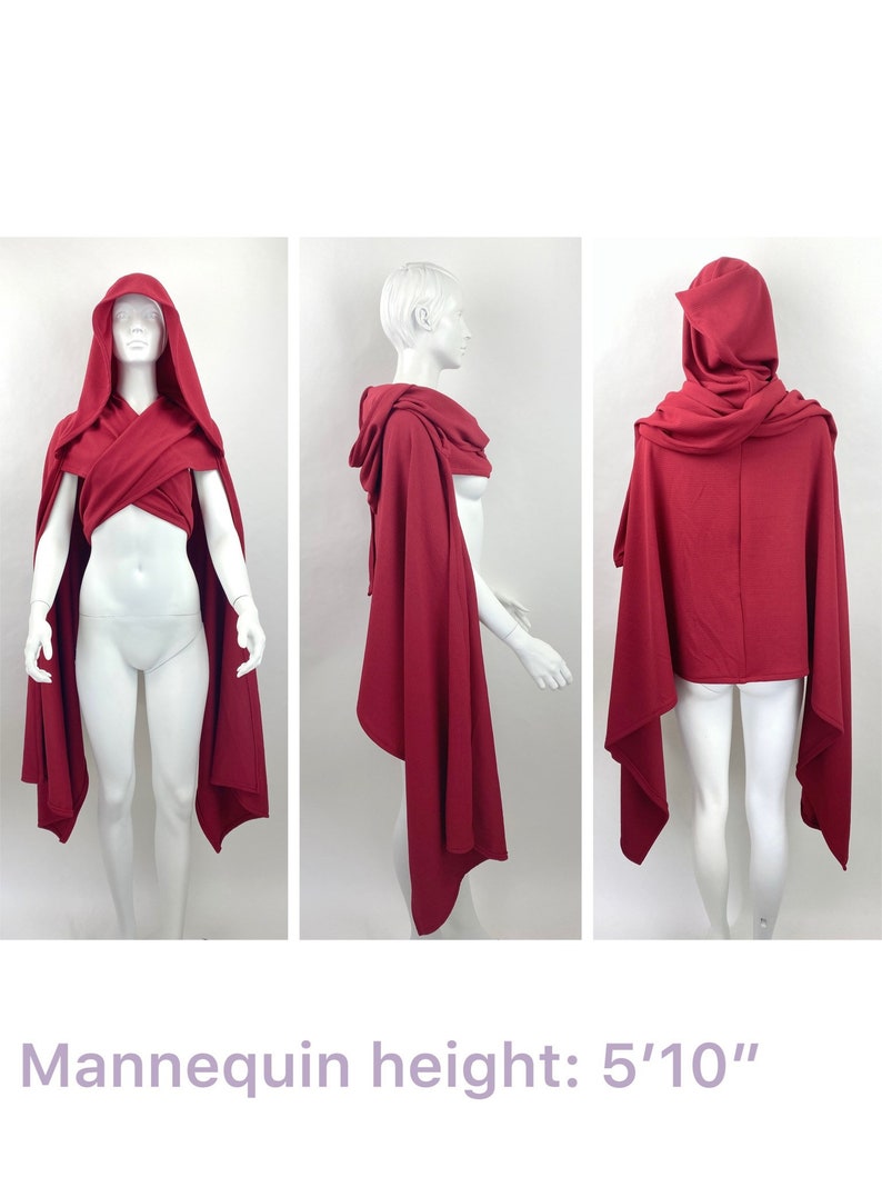 May include: A red hooded cape with a long, flowing design. The cape is draped over a mannequin, showing the front, side, and back views. The mannequin is 5'10" tall.
