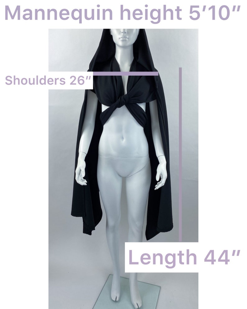 May include: Black hooded cape with a tied front, shoulders measure 26 inches and length is 44 inches.