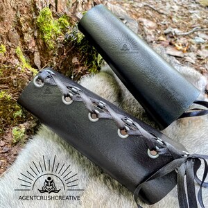 Leather bracers showing the lacing and grommets