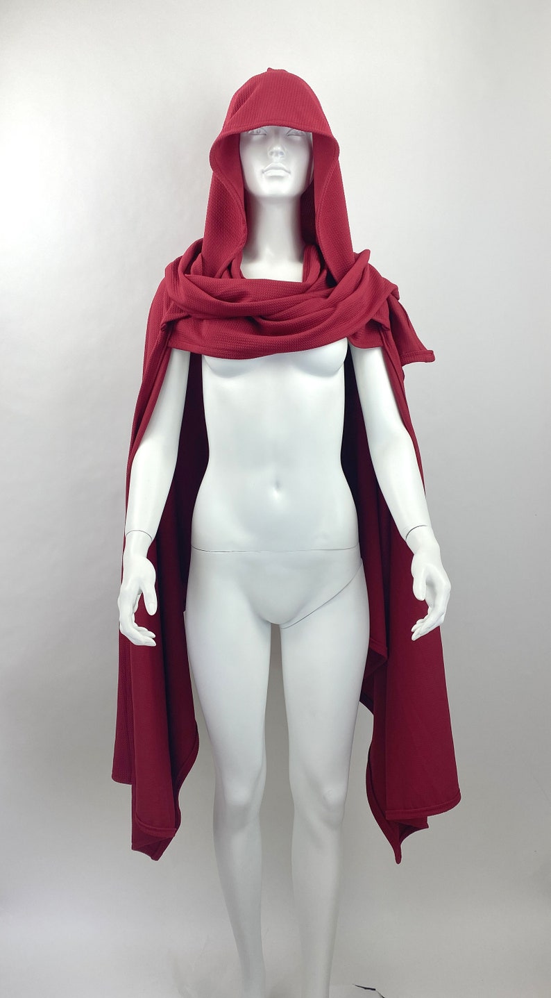 Style: scarf piece sitting on the shoulders and neck like a regular scarf