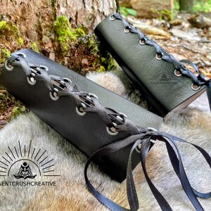 Leather bracers showing the lacing and grommets