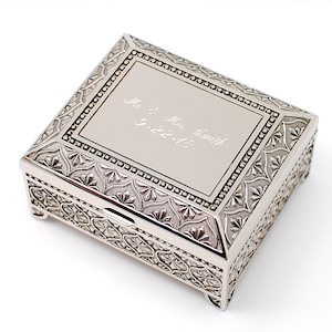 May include: A silver metal keepsake box with an ornate design and an engraved inscription that reads "Mr. & Mrs. Smith 9-22-13".